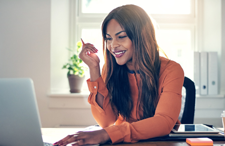 Business woman booking travel on laptop